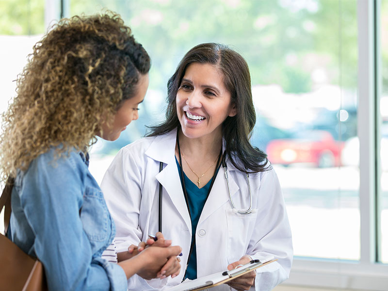 Doctor Helping Woman